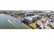 Stunning aerial view of waterfront condos showcasing the scenic coastal landscape and nearby ocean access at 1240 Dolphin Bay Way # 304, Siesta Key, FL 34242