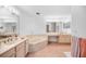Spacious bathroom features a large soaking tub, double vanity, and separate makeup area at 1240 Dolphin Bay Way # 304, Siesta Key, FL 34242