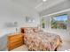 Comfortable bedroom with natural light, ample closet space, and calming decor at 1240 Dolphin Bay Way # 304, Siesta Key, FL 34242