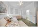 Bright bedroom with a daybed, natural light, and a door to the outside at 1240 Dolphin Bay Way # 304, Siesta Key, FL 34242