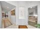 Hallway with artwork and niche, leading to a bedroom, creating a welcoming atmosphere at 1240 Dolphin Bay Way # 304, Siesta Key, FL 34242