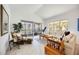 Cozy living room with large windows and comfortable seating area, perfect for relaxing at 1240 Dolphin Bay Way # 304, Siesta Key, FL 34242