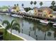 Charming waterfront community featuring colorful homes, private docks, and scenic waterway views at 1240 Dolphin Bay Way # 304, Siesta Key, FL 34242