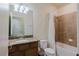 Standard bathroom with a shower-tub combo, a toilet, and a wooden vanity with a sink at 12616 Richezza Dr, Venice, FL 34293