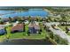 Aerial view of the house with screened pool overlooking a beautiful lake at 13107 Bridgeport Xing, Lakewood Ranch, FL 34211