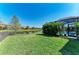 Well-maintained backyard with lush green grass and view of the lake at 13107 Bridgeport Xing, Lakewood Ranch, FL 34211