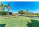 Well-maintained backyard with lush green grass and view of the lake at 13107 Bridgeport Xing, Lakewood Ranch, FL 34211