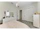 Bedroom featuring wood-look floors and neutral colors at 13107 Bridgeport Xing, Lakewood Ranch, FL 34211