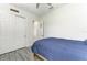 Cozy bedroom featuring a closet, ceiling fan and a twin size bed with blue bedding at 13107 Bridgeport Xing, Lakewood Ranch, FL 34211