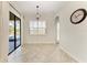 Bright dining room featuring tile floors, white walls and trim, and a sliding door to the lanai at 13107 Bridgeport Xing, Lakewood Ranch, FL 34211