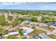 Property aerial view showing community with mature trees, water features, and well-maintained landscaping at 1320 Magellan Dr, Sarasota, FL 34243