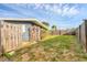 Fenced backyard featuring a well-maintained lawn and plenty of space for outdoor activities at 1320 Magellan Dr, Sarasota, FL 34243