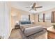 Staged bedroom featuring a large bed, neutral colors, and natural light at 1320 Magellan Dr, Sarasota, FL 34243