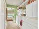 Walk-in closet with ample shelving and storage solutions adjacent to the main bedroom at 1320 Magellan Dr, Sarasota, FL 34243