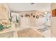 Neutral foyer with wall decor and a view into the rest of the house at 1320 Magellan Dr, Sarasota, FL 34243