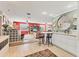 Open concept living room and kitchen with bright colors and modern finishes at 1320 Magellan Dr, Sarasota, FL 34243