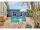 Outdoor pool has a nice view, a brick patio and tropical landscaping around it at 1320 Magellan Dr, Sarasota, FL 34243