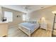 Comfortable bedroom with a ceiling fan, two windows for natural light and stylish decor at 135 River Enclave Ct, Bradenton, FL 34212