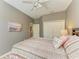 Comfortable bedroom featuring a ceiling fan, closet, and light gray walls at 135 River Enclave Ct, Bradenton, FL 34212
