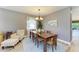 Comfortable dining area with wood floors, furniture and lots of natural light at 135 River Enclave Ct, Bradenton, FL 34212
