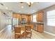 Charming kitchen with stainless steel appliances and a center island with barstool seating at 135 River Enclave Ct, Bradenton, FL 34212