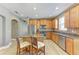 Kitchen featuring stainless steel appliances, an island, and wood-style flooring at 135 River Enclave Ct, Bradenton, FL 34212