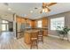 Modern kitchen featuring stainless steel appliances, an island with seating, and tile backsplash at 135 River Enclave Ct, Bradenton, FL 34212