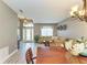 Bright living room featuring an open-concept layout, large windows, and neutral color palette at 135 River Enclave Ct, Bradenton, FL 34212