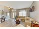 Cozy living room featuring a sectional sofa, decor, and lots of natural light at 135 River Enclave Ct, Bradenton, FL 34212
