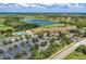 Aerial view of the community pool, clubhouse, and convenient parking area at 135 River Enclave Ct, Bradenton, FL 34212