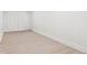 Neat room with light hardwood floors, white walls, and neutral baseboards at 1406 N Riverhills Dr, Temple Terrace, FL 33617