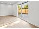 This bonus room features recessed lighting, light wood floors, and sliding glass doors to the backyard at 1406 N Riverhills Dr, Temple Terrace, FL 33617