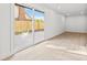 Bonus room features recessed lighting, light wood floors, and sliding glass doors to the backyard at 1406 N Riverhills Dr, Temple Terrace, FL 33617
