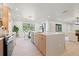 Bright kitchen features stainless steel appliances, modern wood cabinets, and a view to the breakfast nook at 1406 N Riverhills Dr, Temple Terrace, FL 33617