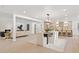 Open-concept living area featuring a modern kitchen, dining space, and stylish living room with fireplace at 1406 N Riverhills Dr, Temple Terrace, FL 33617