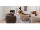 Comfortable living room with a white fireplace, leather chair, and decoratively styled coffee table at 1406 N Riverhills Dr, Temple Terrace, FL 33617