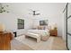 Well-lit main bedroom with modern ceiling fan and light wood floors at 1406 N Riverhills Dr, Temple Terrace, FL 33617