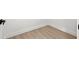 Clean baseboards and light wood floors at 1406 N Riverhills Dr, Temple Terrace, FL 33617