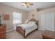 Cozy bedroom with neutral tones, a ceiling fan, and a comfortable bed at 14404 18Th E Pl, Bradenton, FL 34212