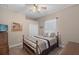 Comfortable bedroom featuring a ceiling fan, closet, and a window with natural light at 14404 18Th E Pl, Bradenton, FL 34212