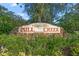 Attractive Mill Creek community sign nestled among trees and greenery at 14404 18Th E Pl, Bradenton, FL 34212