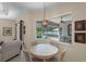 Bright dining nook with views of the screened pool area at 14404 18Th E Pl, Bradenton, FL 34212