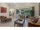 Bright living room with access to lanai/pool area and views to other areas of the home at 14404 18Th E Pl, Bradenton, FL 34212
