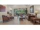 Inviting living room featuring sliding glass doors to the lanai and neutral decor at 14404 18Th E Pl, Bradenton, FL 34212