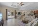 Spacious living room with sliding glass doors to the lanai and a view to the dining area at 14404 18Th E Pl, Bradenton, FL 34212