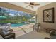 Relaxing screened-in pool area with comfortable seating, perfect for outdoor entertaining and relaxation at 14404 18Th E Pl, Bradenton, FL 34212