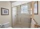 Shower with glass door and tiled walls at 14404 18Th E Pl, Bradenton, FL 34212