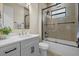 Bathroom featuring a shower over tub, modern fixtures, and sleek vanity at 193 Rotonda N Blvd, Rotonda West, FL 33947
