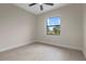 Bedroom features a neutral color palette, ceiling fan, and beautiful natural light at 193 Rotonda N Blvd, Rotonda West, FL 33947