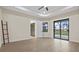 Bedroom featuring a sliding glass door to the pool area and tiled floors at 193 Rotonda N Blvd, Rotonda West, FL 33947
